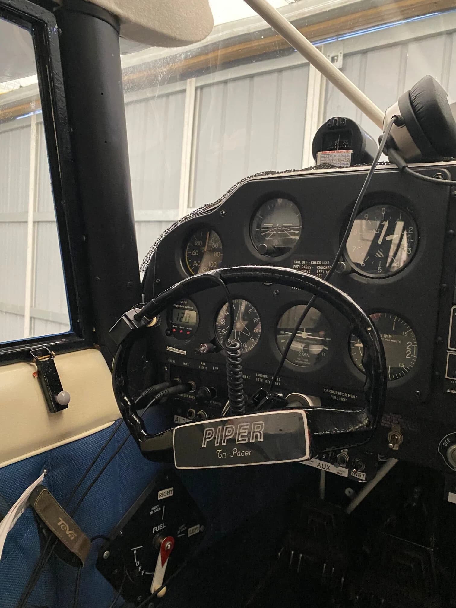View of the Piper Tri-Pacer's instrument panel and yoke.
