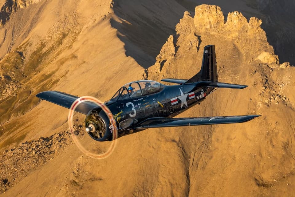 Front view of the HB-RMW T-28B Trojan in flight.