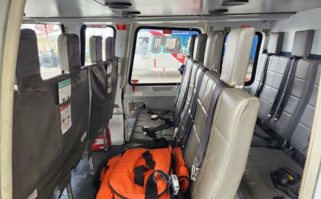 The helicopter's cockpit features a complex array of instruments and controls.