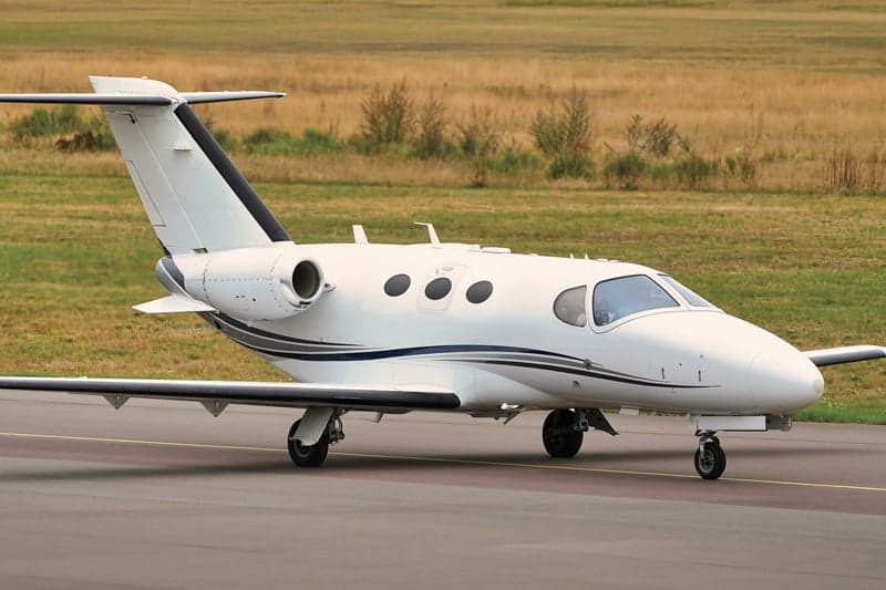 Side view of the OE-FDT aircraft on the ground.