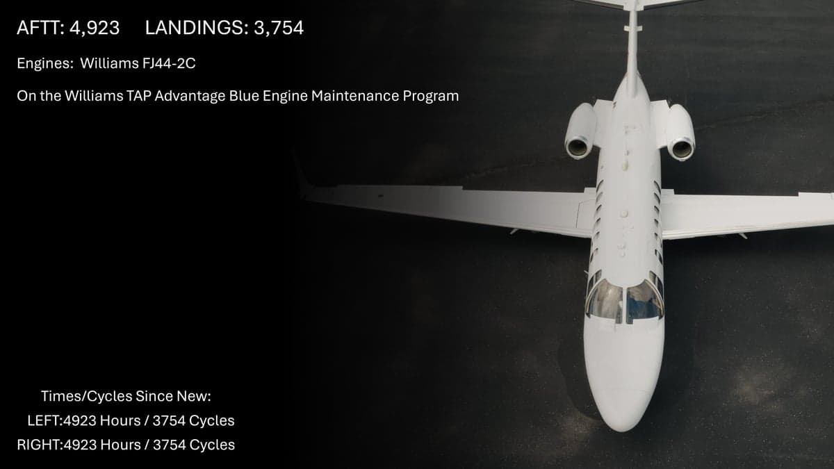 Top-down view of a white Citation CJ2 aircraft with text overlayed showing aircraft times and cycles.