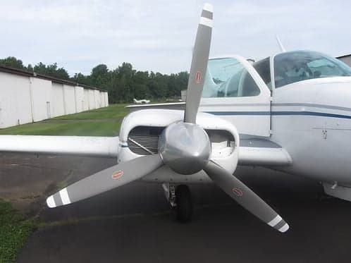 Close-up of the propeller and front of a Beechcraft Bonanza N8969M.