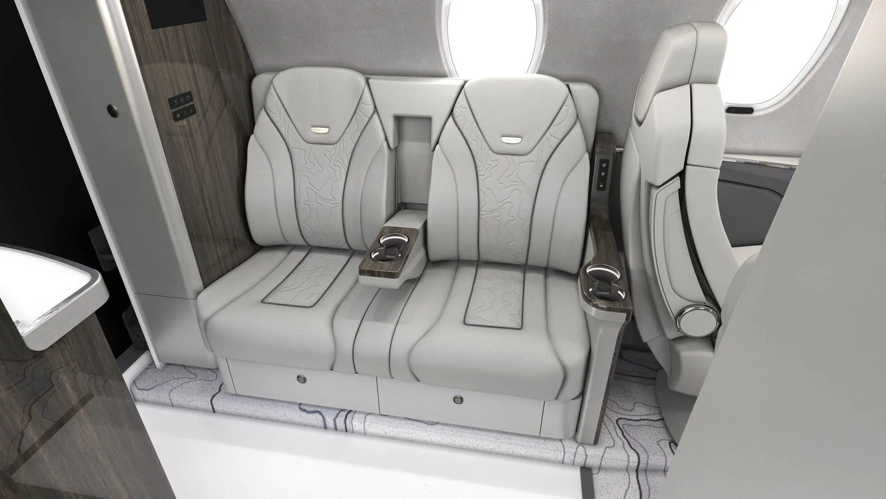 View of the aircraft's interior with white leather seats and wood trim.