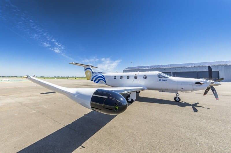 A Pilatus PC-12 aircraft with registration PH-CYP on the tarmac.