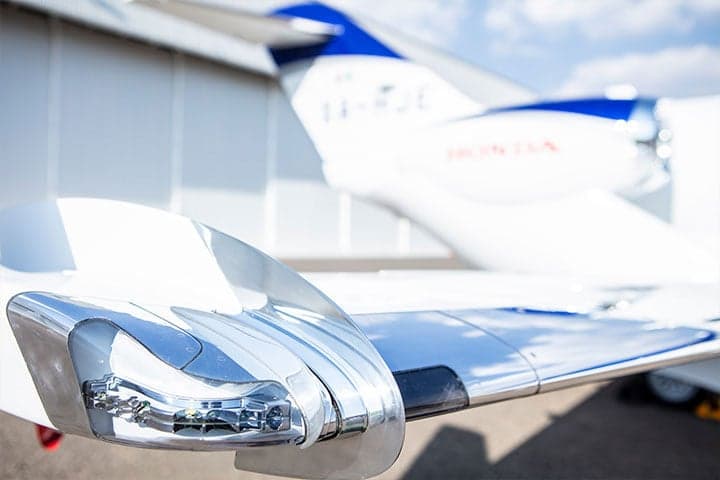 Close-up of the winglet and tail of a HondaJet with registration XA-HJE.