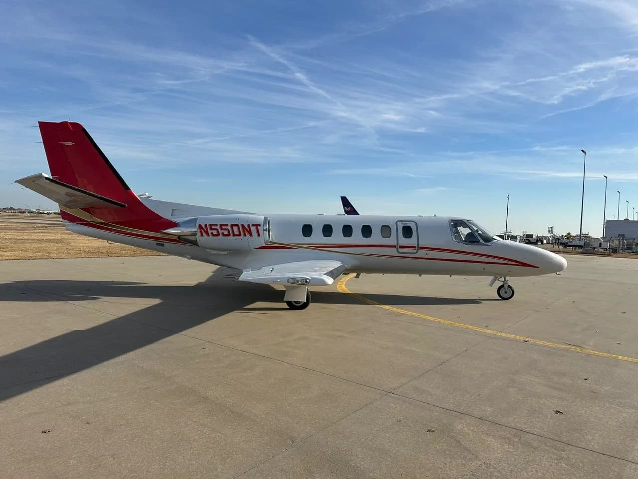 Side view of Cessna Citation CJ1+ aircraft N550NT on the ground.