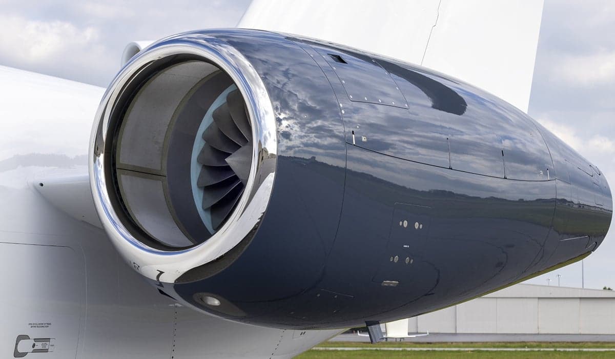 Close-up of the aircraft's engine showing the turbine blades.