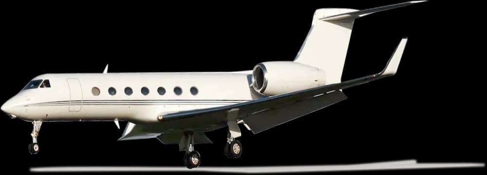 A white Gulfstream jet on the ground with a black background.