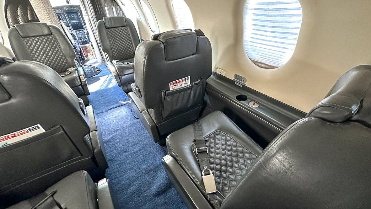 Interior view of the Pilatus PC-12 cabin with leather seats.
