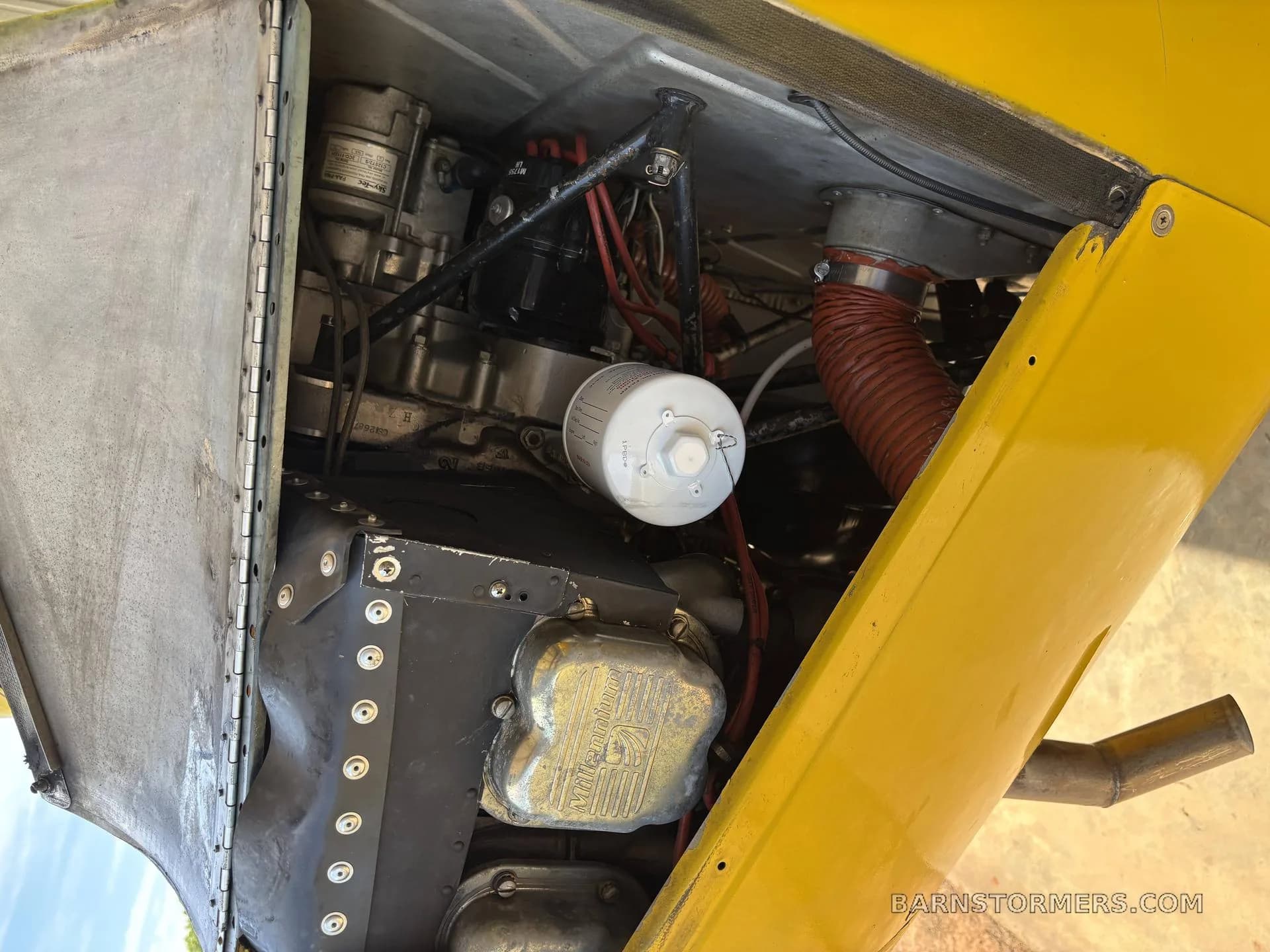 A close-up view of the aircraft's engine compartment, showing the engine and various components.