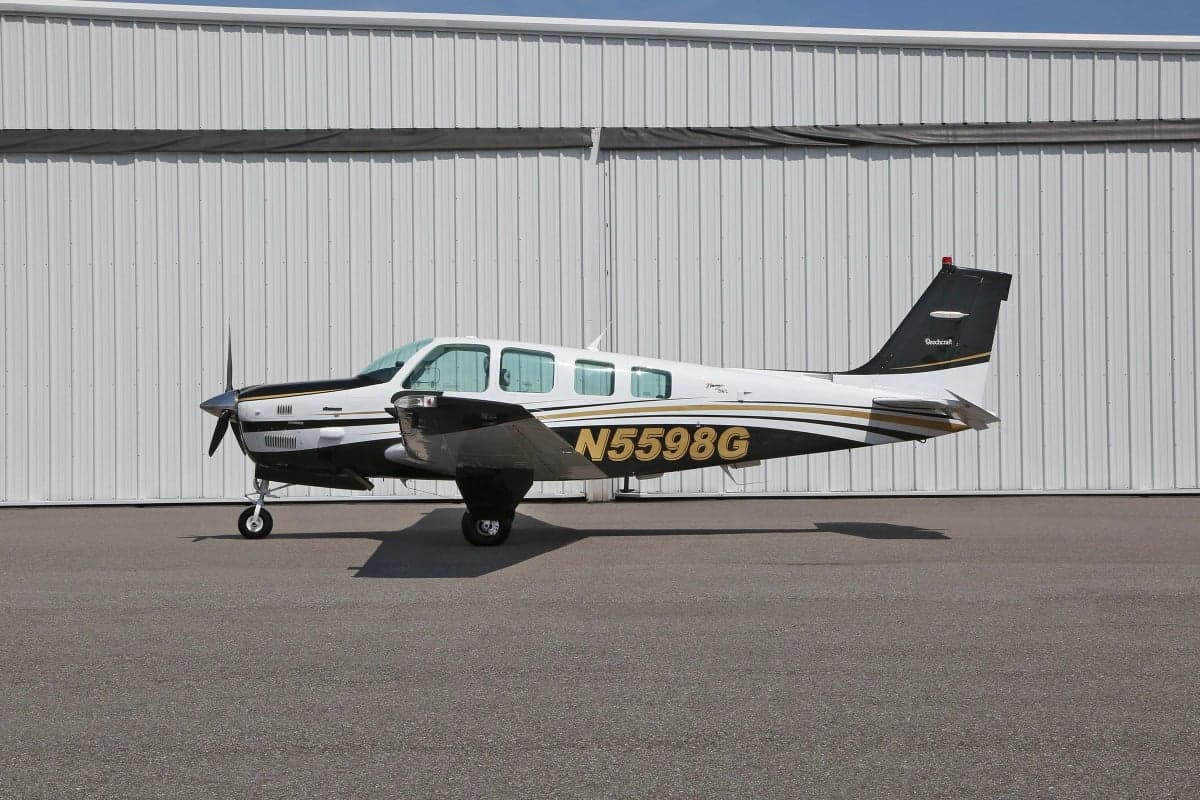 Side view of a Beechcraft Bonanza aircraft with tail number N5598G.