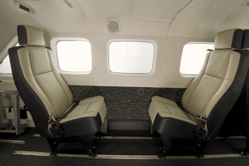 Interior view of the Cessna Caravan cabin with leather seats.