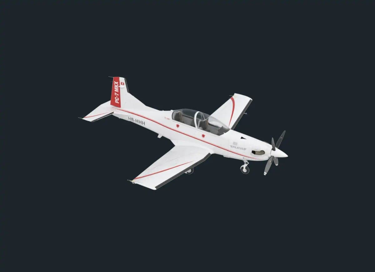 A Pilatus PC-7 MKX aircraft on a gray background.