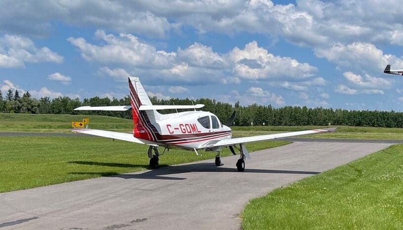 Rear view of the Piper PA-28R-201T Turbo Arrow III on a runway.