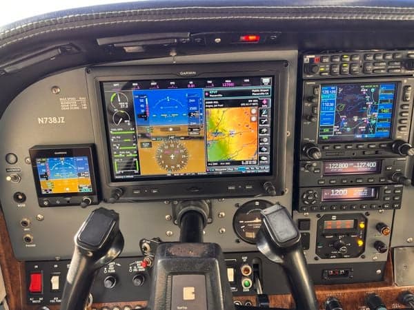 Instrument panel of N738JZ, showing Garmin displays and flight controls.