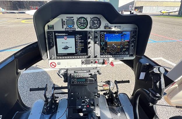 Bell 407 helicopter cockpit with G1000 avionics.
