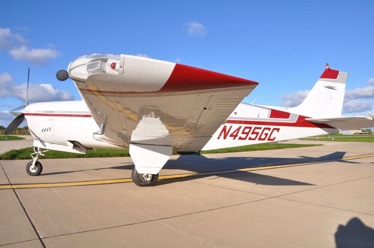 Side view of a Beechcraft Bonanza showing the N number N495GC.