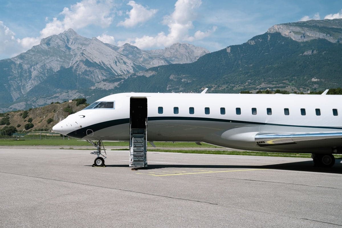 A side view of a Bombardier Global XRS aircraft with the airstair deployed.