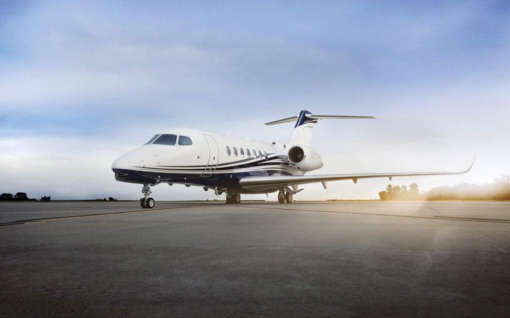 A Citation Longitude jet parked on the tarmac.