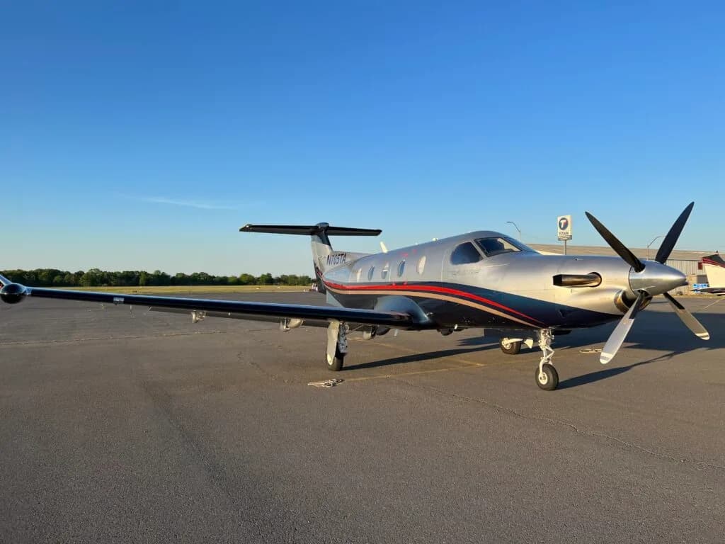 A Pilatus PC-12 parked on the tarmac.