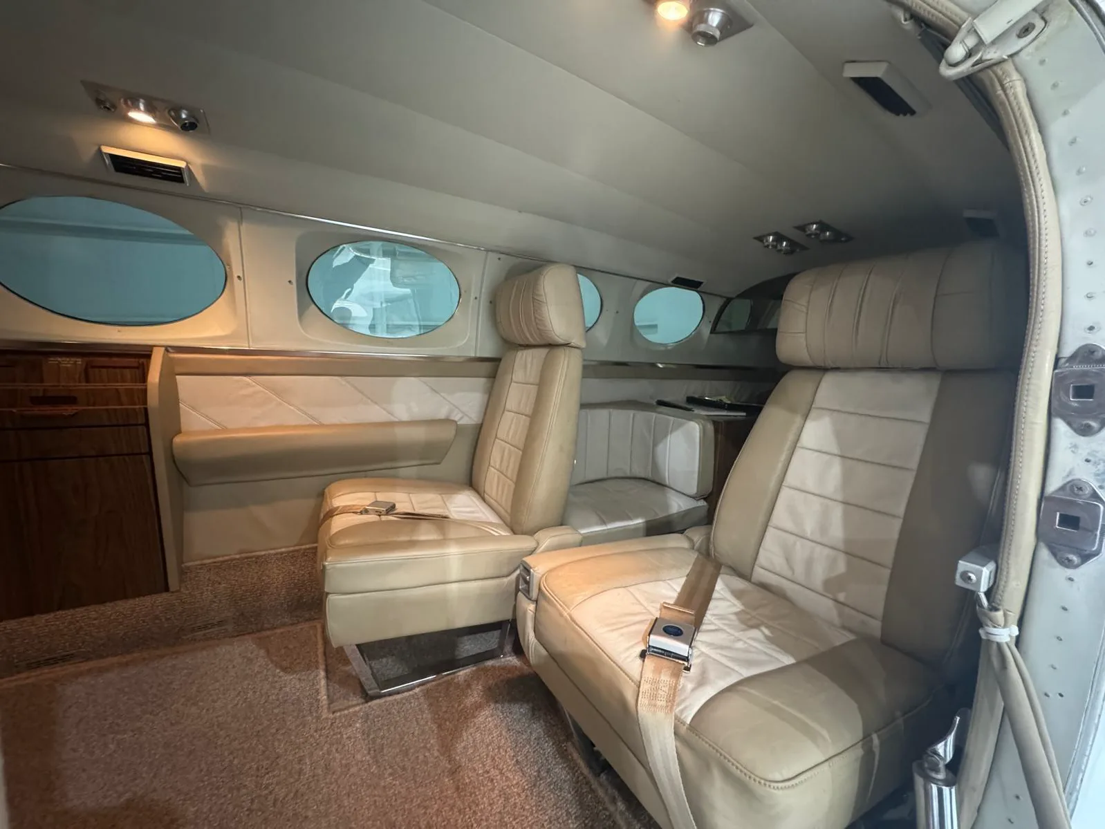 The interior of a Cessna 421 Golden Eagle with tan leather seats.