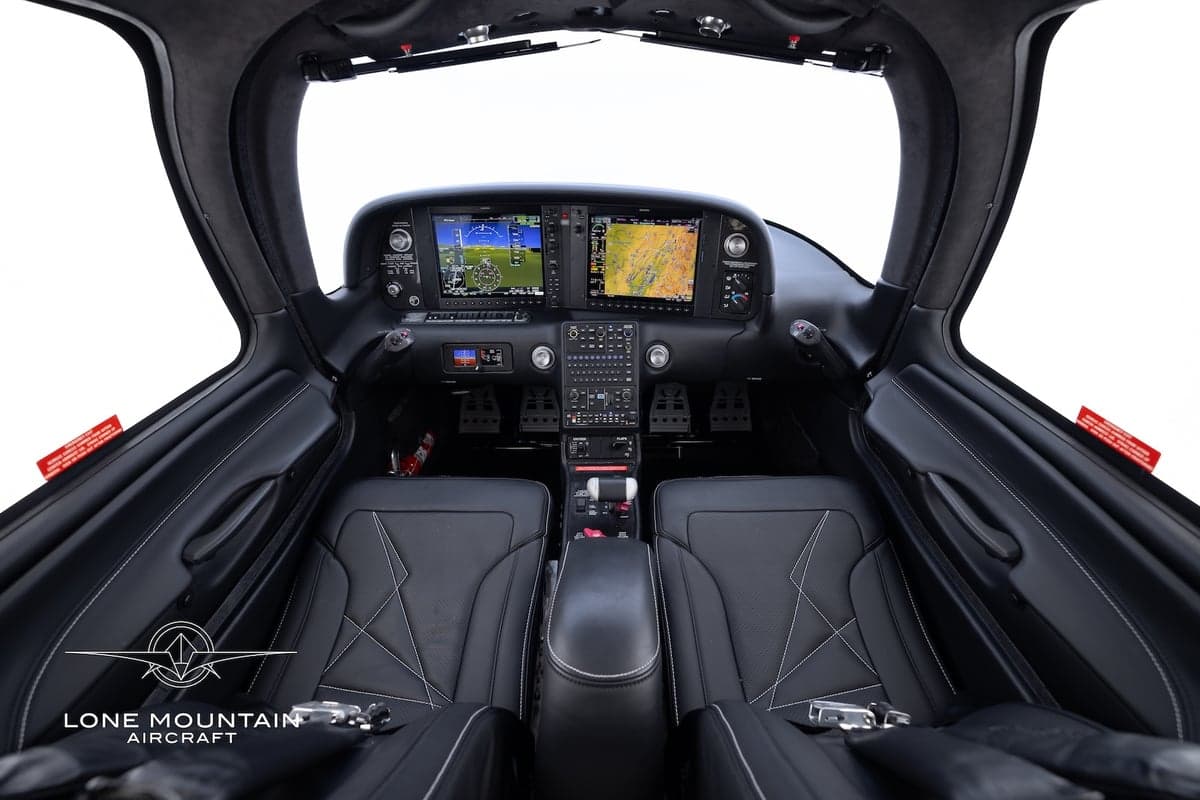 View of the Cirrus SR22T cockpit featuring a modern glass panel display.