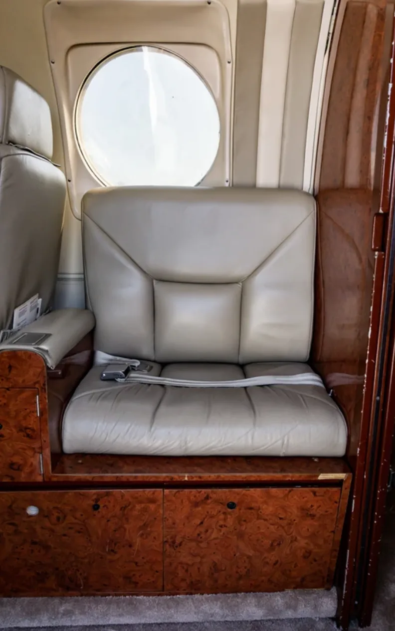 Close-up of a single seat in the Beechcraft King Air 200 cabin.