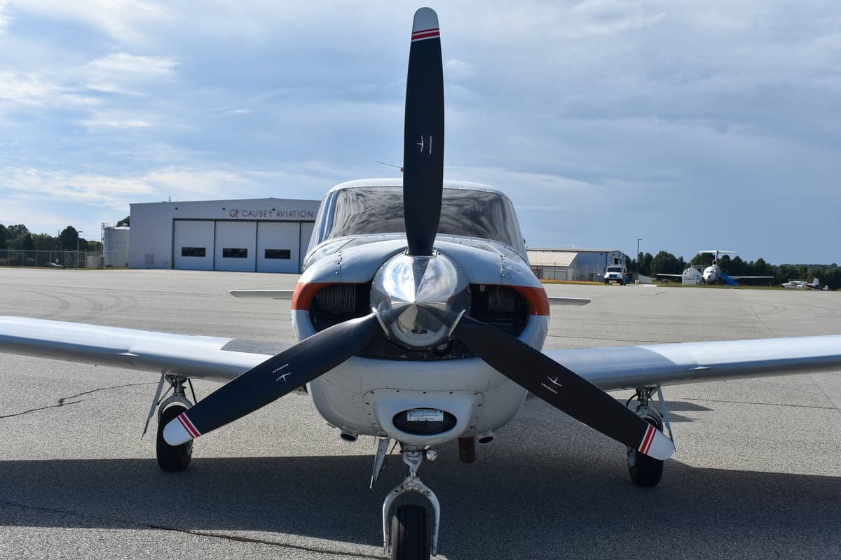 Piper Comanche 250 aircraft, rear quarter view, on the tarmac with registration N5217P.