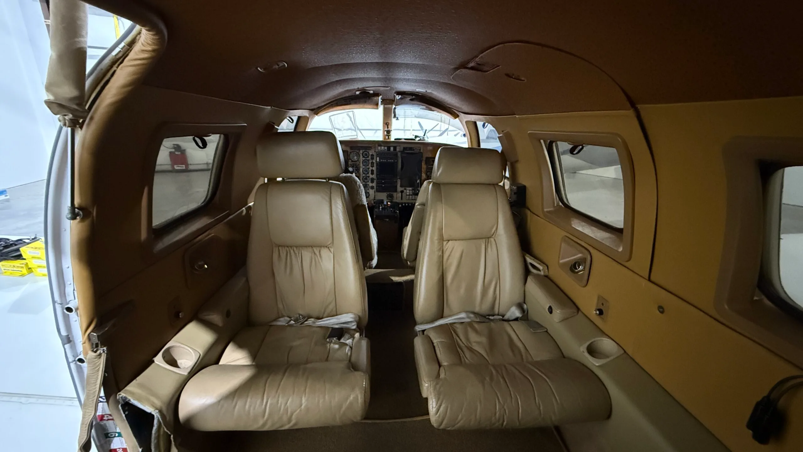 View of the aircraft interior with leather seats.