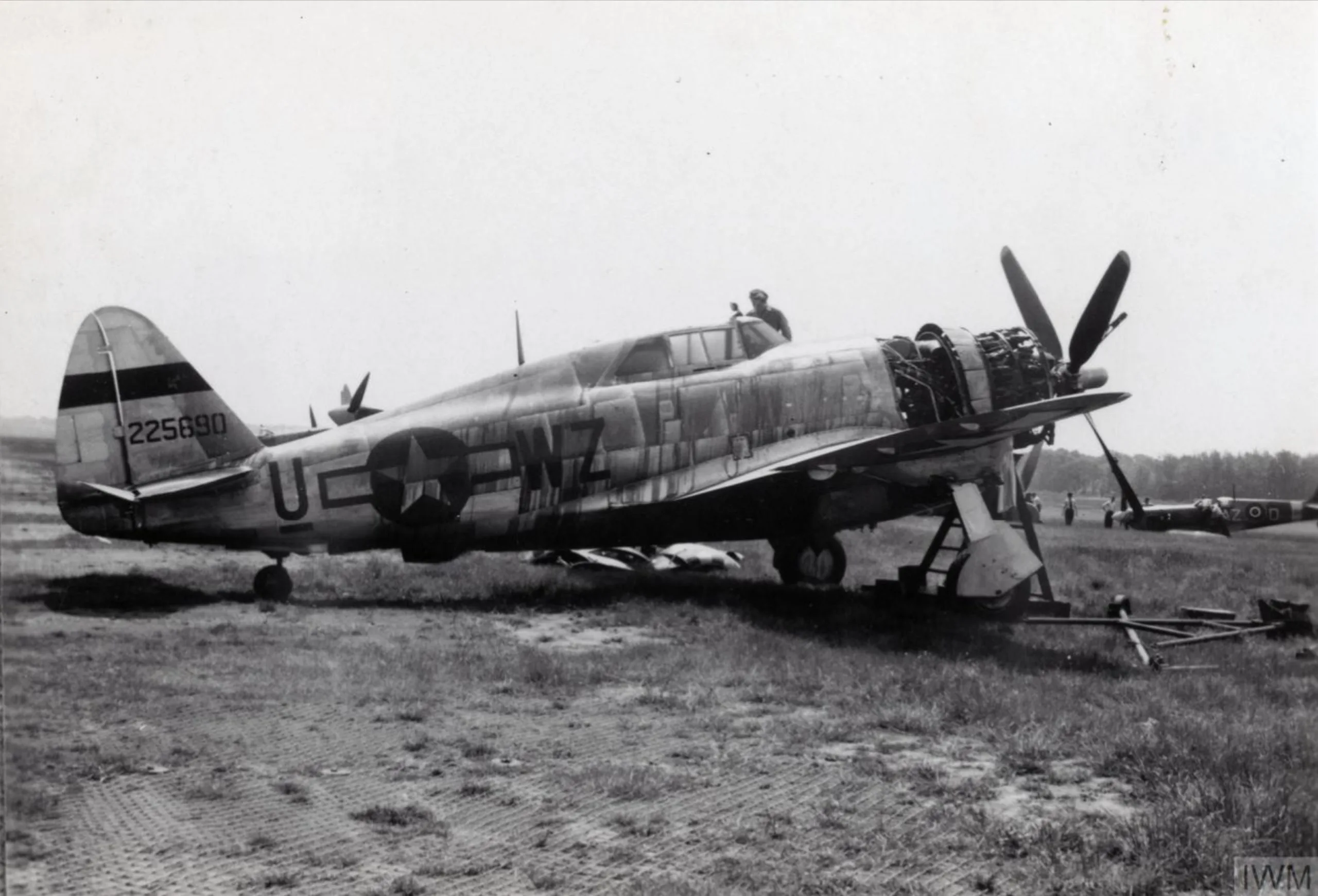 Black and white photo of a Republic P-47 Thunderbolt on the ground.