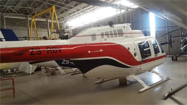 Tail section of a Bell Jet Ranger helicopter with registration ZS-RDV.