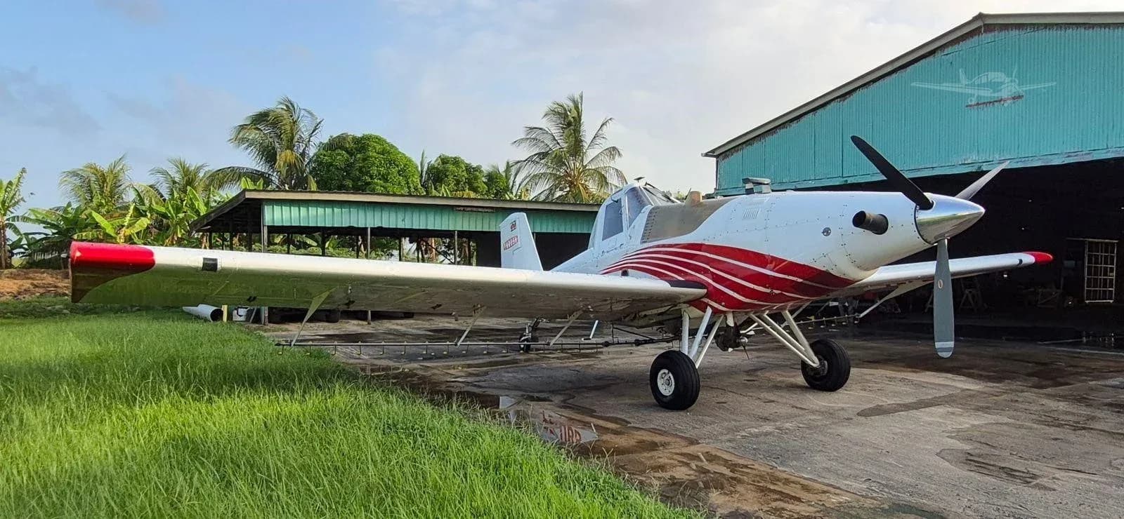 Air Tractor AT-502 parked outside a hangar.