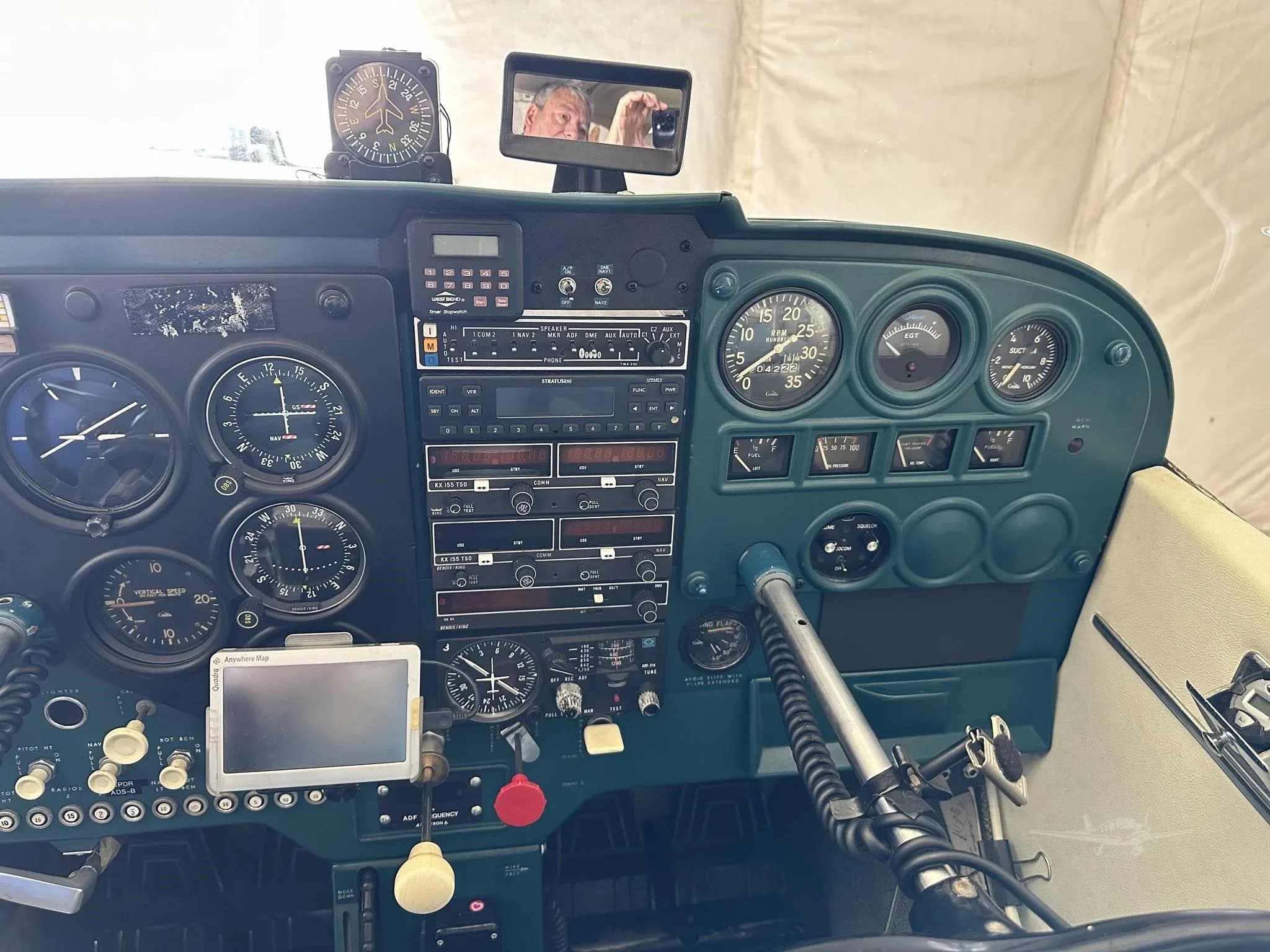 A close-up of the instrument panel of a Cessna N7959U, showing gauges and radio stack.