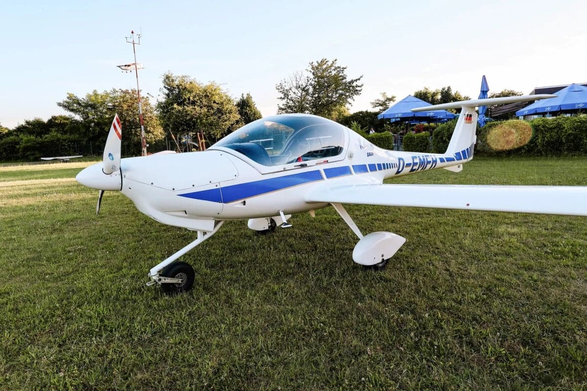 Front quarter view of a Diamond DA20 Katana D-EMFH parked on grass.