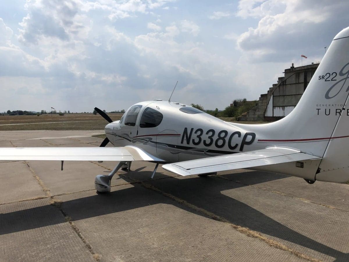 Close up of the front of the Cirrus SR22T with registration N338CP.
