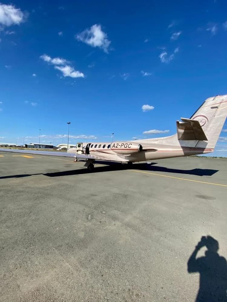 A2-PGC Cessna Citation Mustang on the tarmac with the door open.