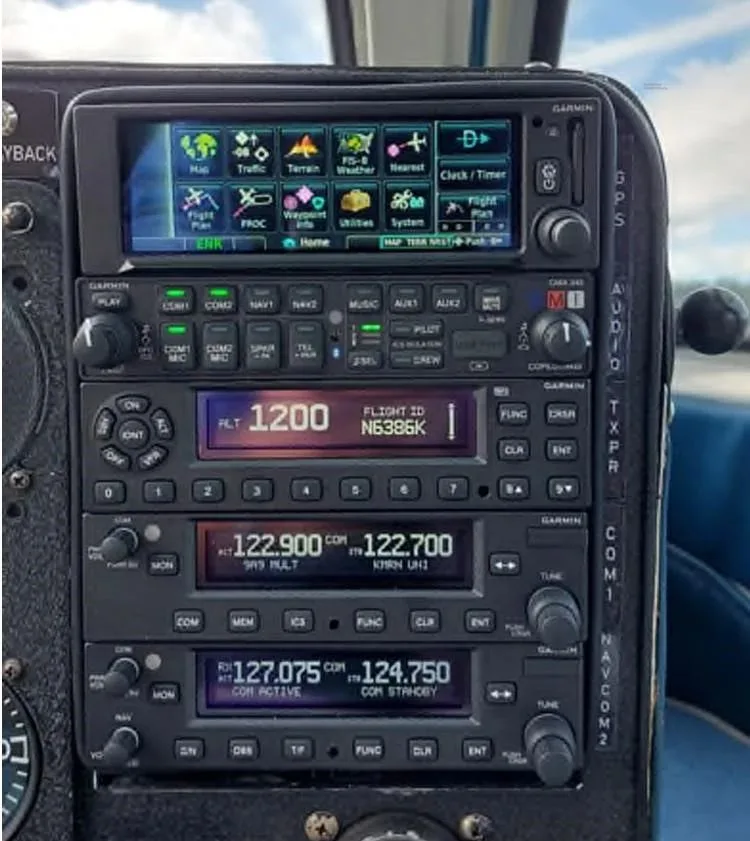 A close-up of the avionics stack in the N6386K cockpit, showing communication and navigation radios.