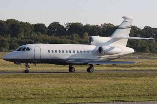 Side view of a Falcon aircraft on the ground.