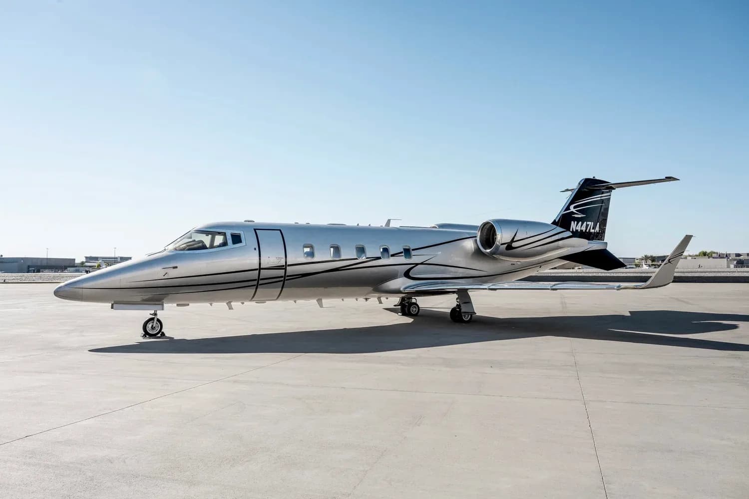 Learjet 45XR, registration N447LA, parked on the tarmac.