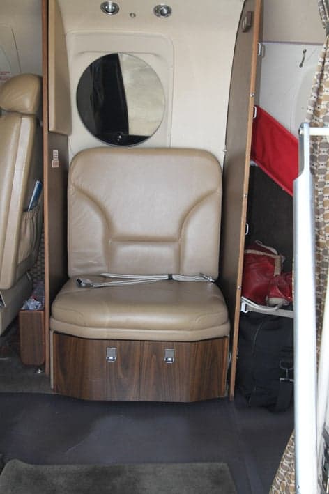 Interior view of the Beechcraft King Air 200 cabin with a single seat.