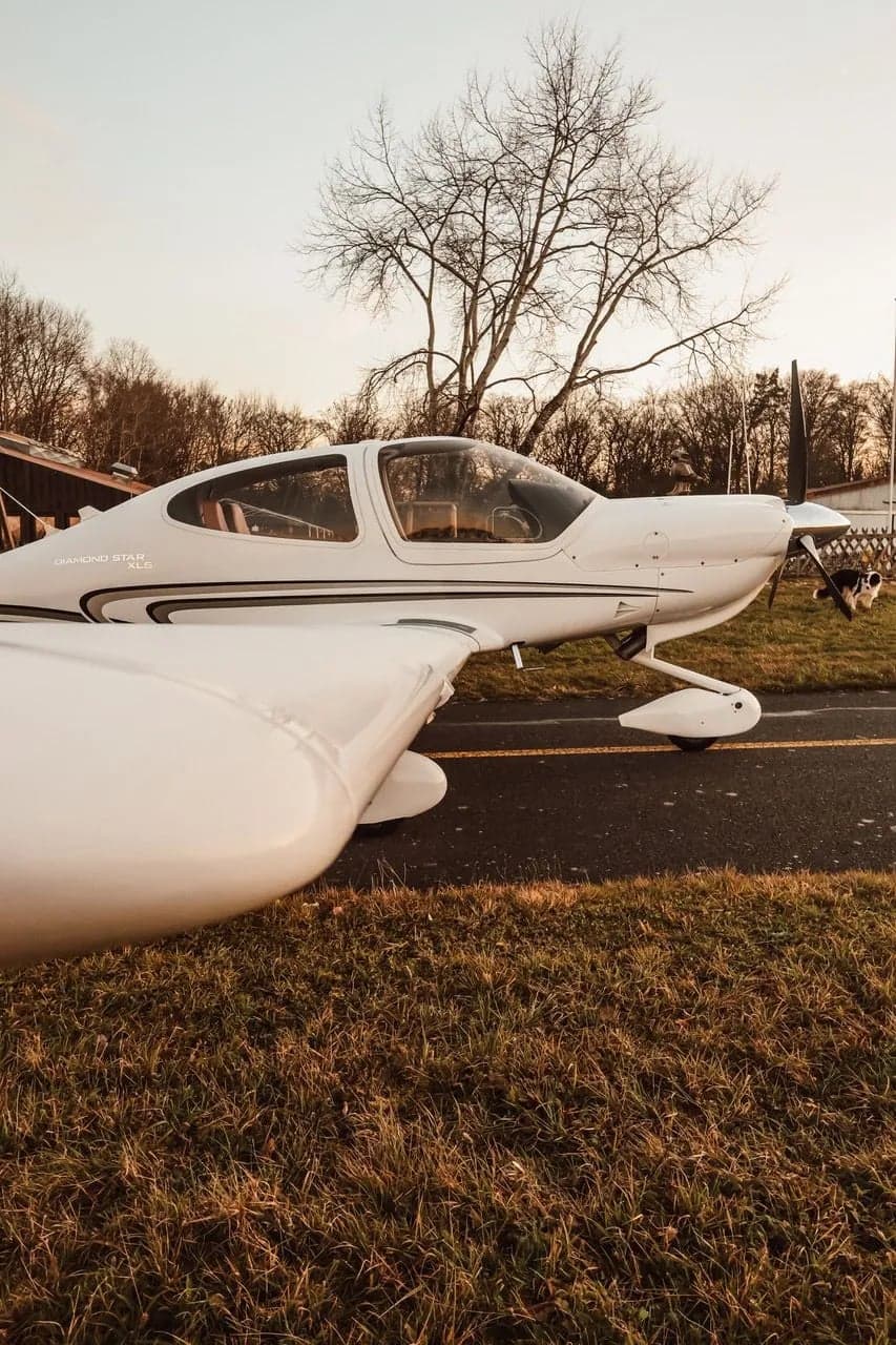 Side view of a Diamond DA40 XLS on the runway.
