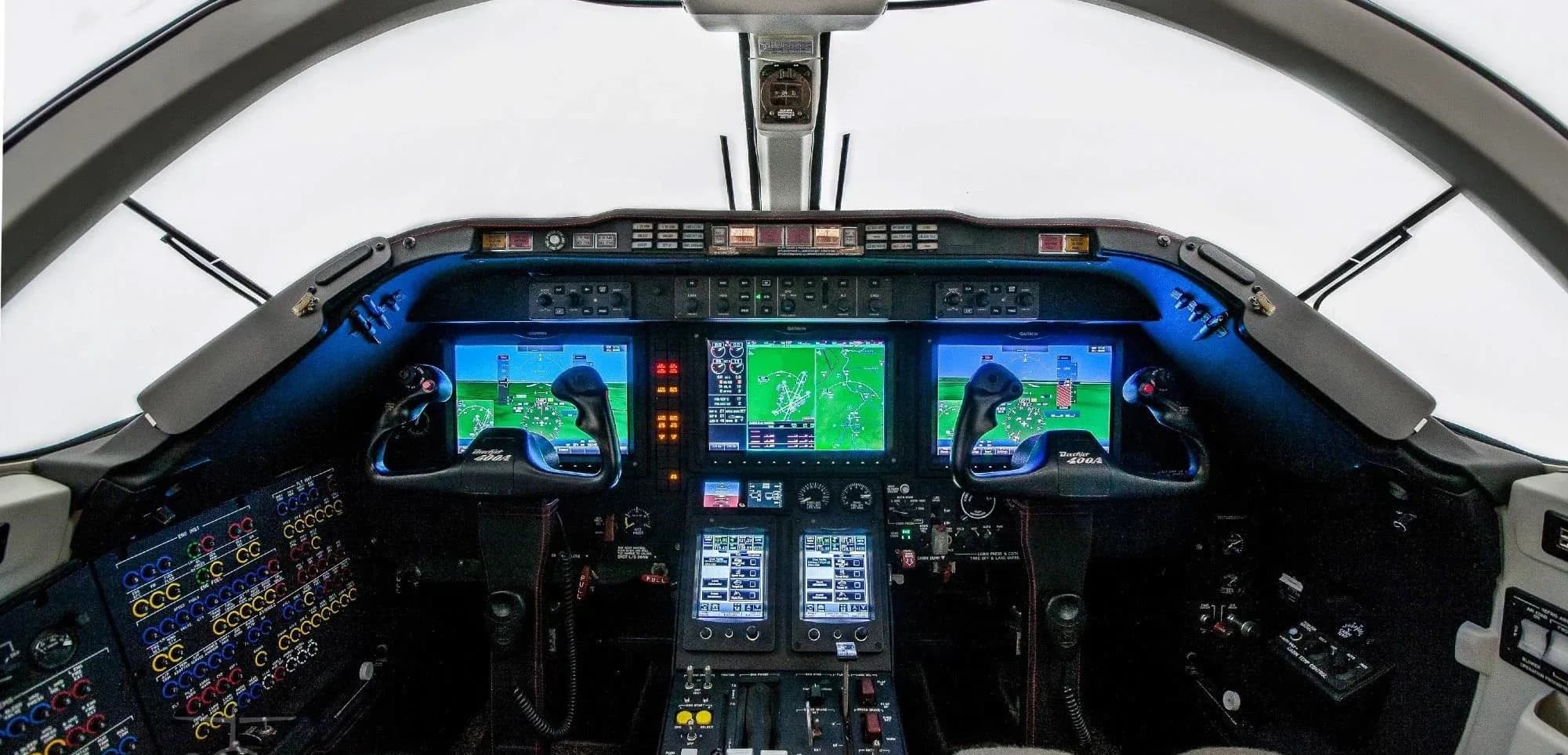 The interior of a King Air 350 aircraft with leather seats and round windows.