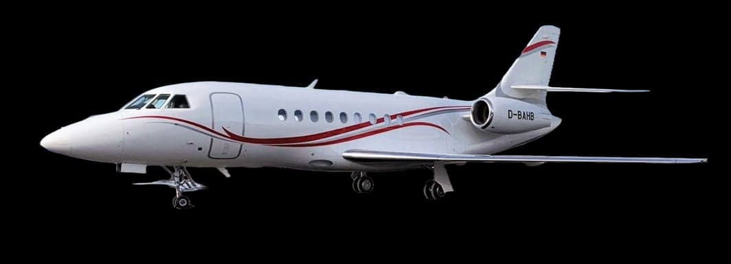 A white aircraft with red stripes on a black background.