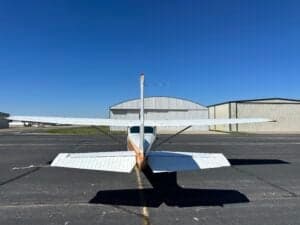 A Cessna 182RG on the tarmac, viewed from the rear.