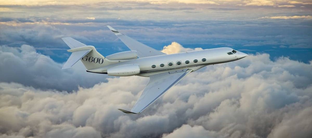 A Gulfstream G600 flying above the clouds.