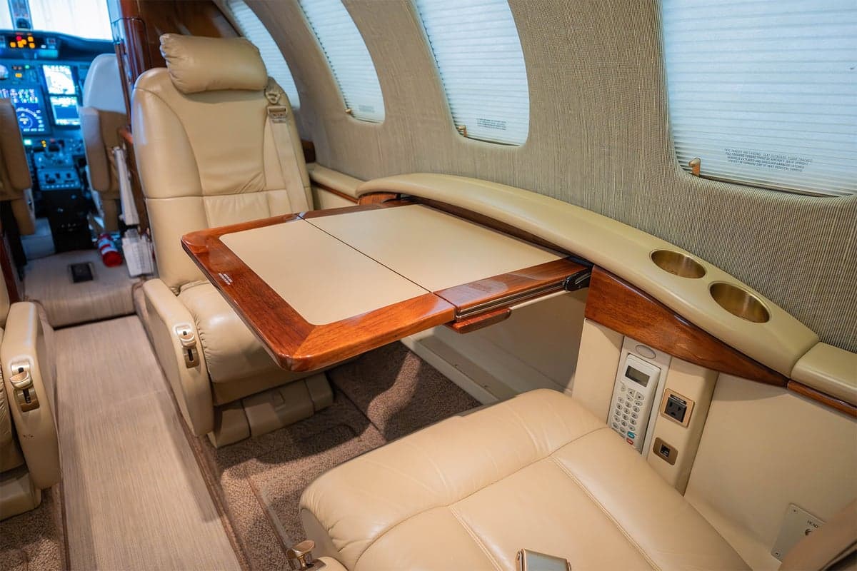 View of the aircraft interior showing a table and seats.