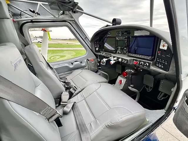 The interior of a Glasair Sportsman aircraft, showing the seats and instrument panel.