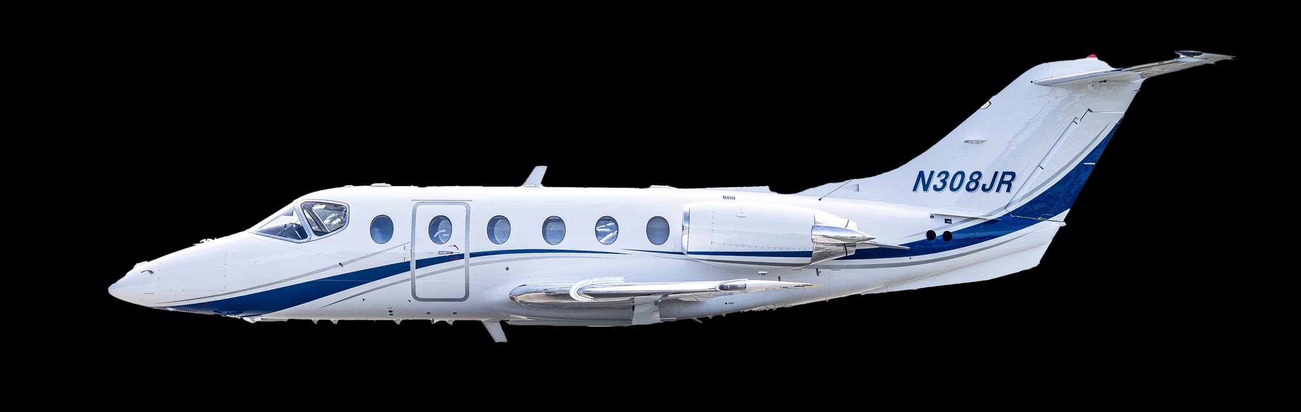 Side view of a white and blue jet with registration N308JR against a black background.