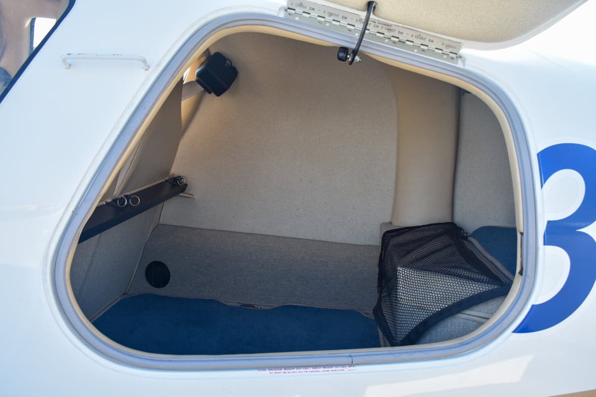 Rear seats of the aircraft with sheepskin covers.