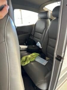 Rear seats of the Cessna 172 Skyhawk with gray leather upholstery.
